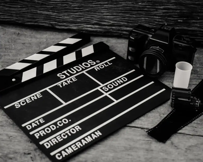 What are the essential elements every professional film review should include?